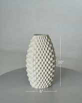 High Objects Arisca Vase, a 10" tall white ceramic vase with a 3D printed textured wave pattern.