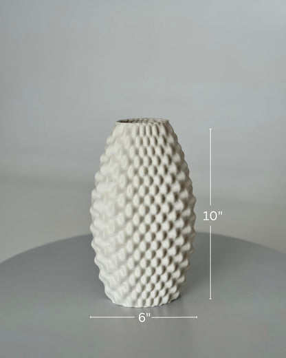 High Objects Arisca Vase, a 10" tall white ceramic vase with a 3D printed textured wave pattern.