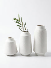 High Objects set of 3 white ceramic vases with textured diagonal line pattern. Various sizes.
