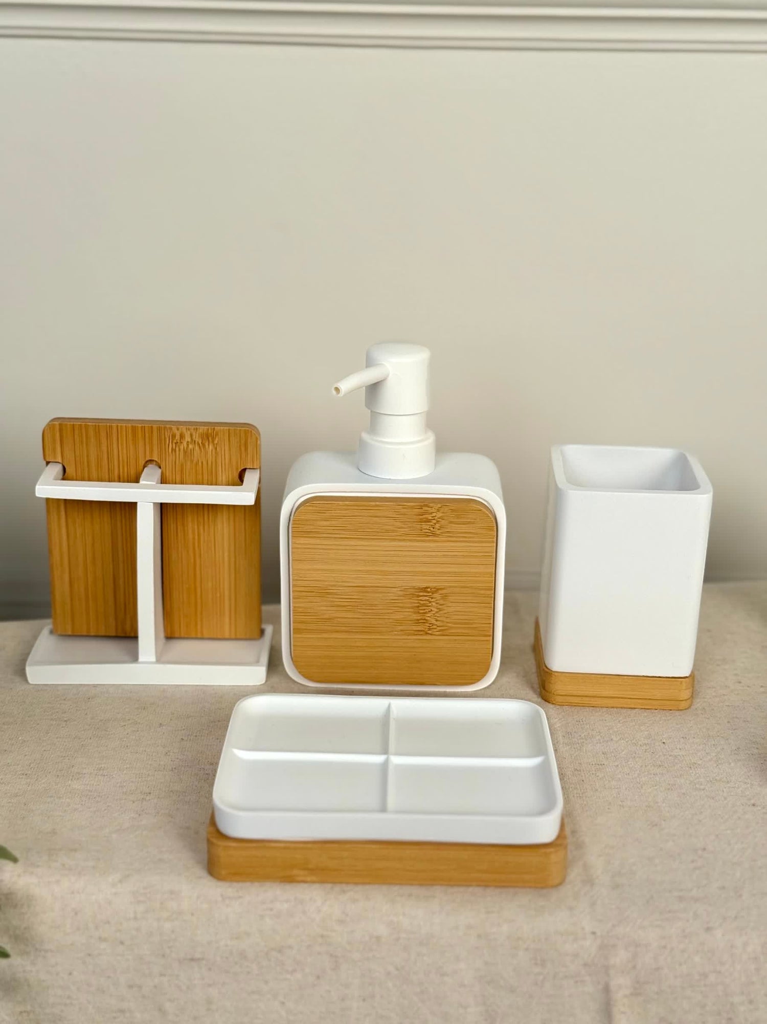 High Objects Zenform Bathroom Essentials Set: white soap dispenser, toothbrush holder, and tray with bamboo accents.