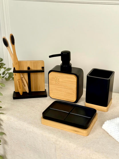 High Objects Zenform Bathroom Essentials Set: black and bamboo soap dish, dispenser, toothbrush holder, and cup.