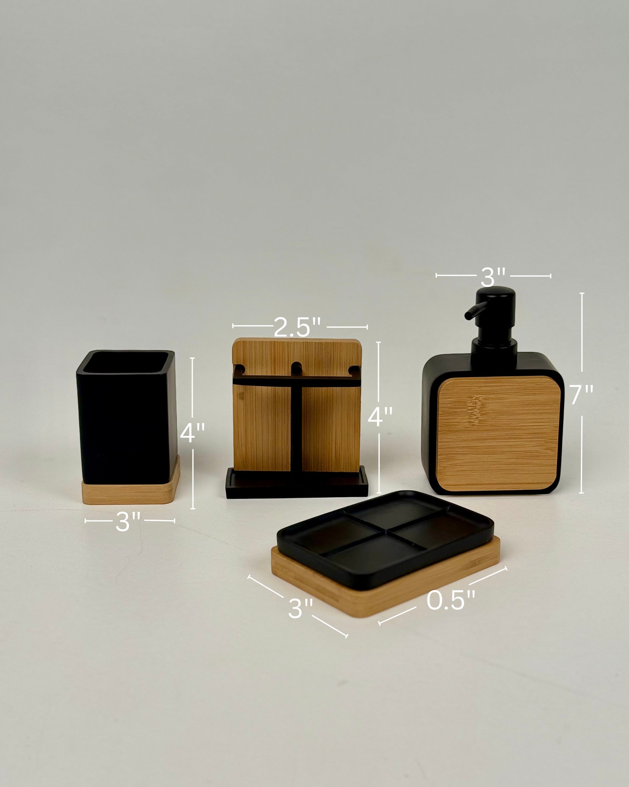 High Objects Zenform Bathroom Essentials Set: black and bamboo toothbrush holder, soap dish, and lotion dispenser.