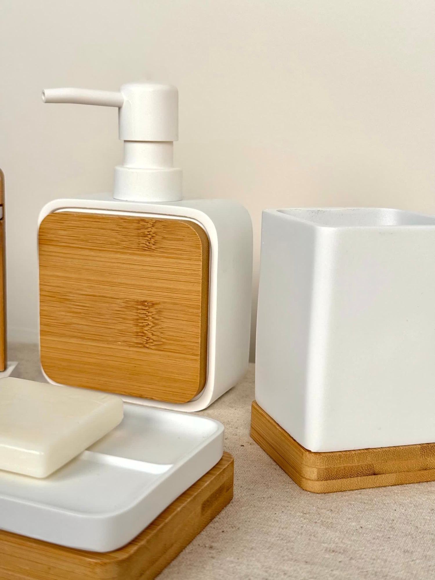 High Objects Zenform Bathroom Essentials Set: white soap dispenser, soap dish, and cup with bamboo accents.