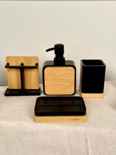 High Objects Zenform Bathroom Essentials Set: black and bamboo soap dispenser, toothbrush holder, cup, and tray.