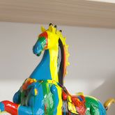 High Objects colourful abstract horse sculpture with bold paint strokes on a decorative base.