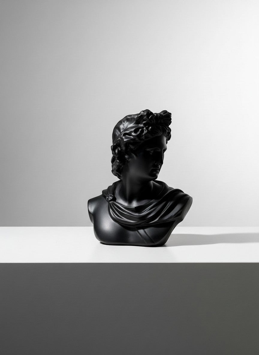 High Objects black matte bust of Apollo, classical Greek sculpture, draped garment detail.