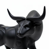 High Objects black matte bull showpiece with powerful stance and curved horns, ideal for desk or shelf decor.
